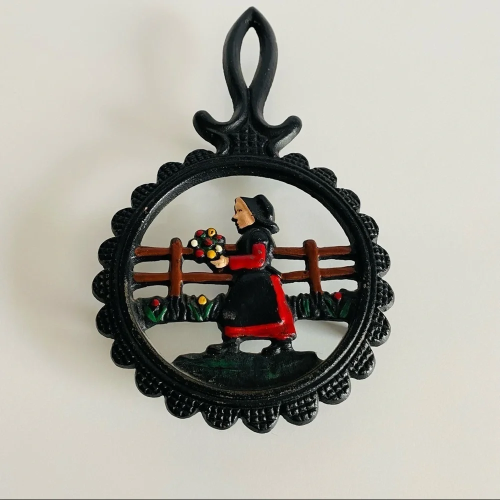 Vintage  Cast Iron Amish Woman and  man Trivets.